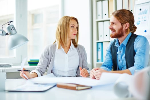 Two business people talking in office