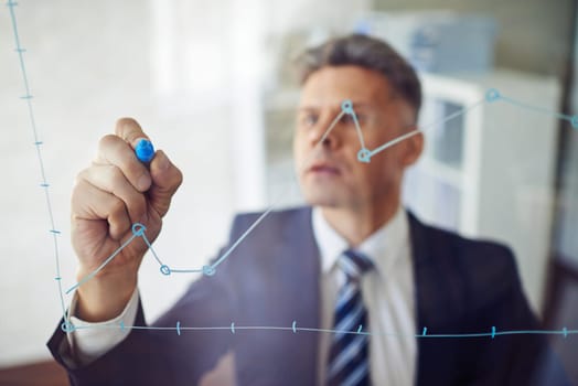 Confident man writing graph