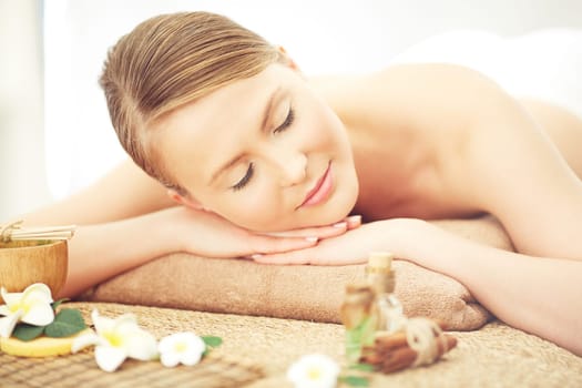 Young woman relaxing at spa salon