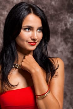 Young pretty girl woman with long black hair in red top as portrait with text space