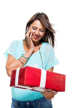 Happy attractive young woman with red gift with white bow Cheerfully isolated against white background with text space