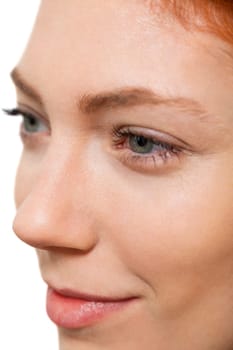 Close-up of a female face with eye lip nose and eyebrows isolated on white background