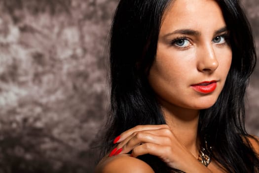 Young pretty girl woman with long black hair in red top as portrait with text space