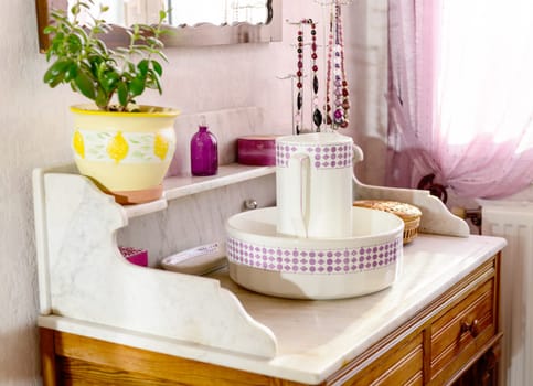 pitcher and lavatory bowl in a rustic bedroom