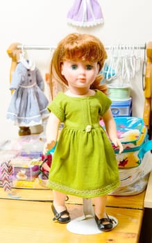 doll with red hair and several dresses