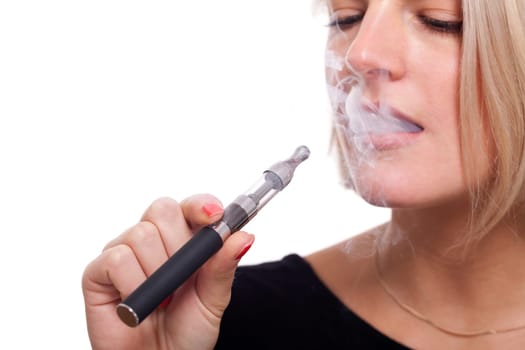 Young woman smokes an e-cigarette with blonde hair portrait isolated against white background