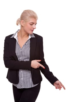 Young woman in business clothes shows with both arms in one direction isolated on white background