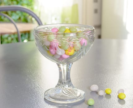 cup filled with candy for Easter on table