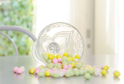 cup filled with candy for Easter reversed on table