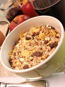 Ceramic bowl with muelsi and fresh fruits