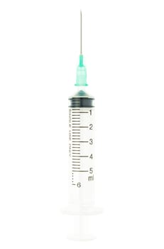 Plastic green syringe isolated on white background on vertical view. Single use medical tool in hospital for injection.