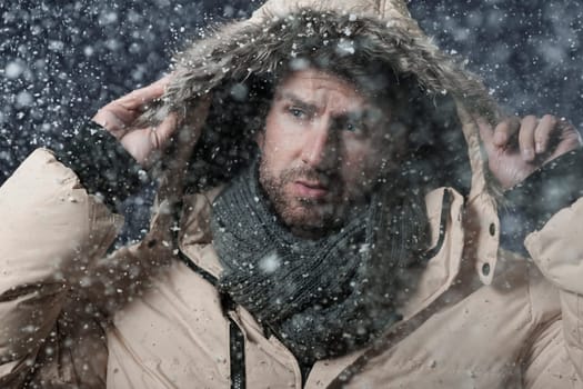 Handsome man in snow storm