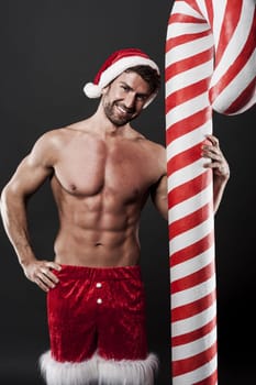 Delicious christmas candy cane with sexy man