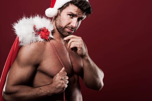 Santa claus with sack full of christmas presents