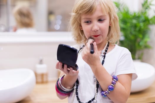 Playing with mommy's jewelry and cosmetics