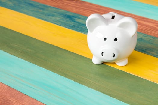Piggy bank on color wooden background,financial investment or saving concept