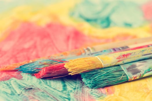 Dirty watercolor brushes close-up view