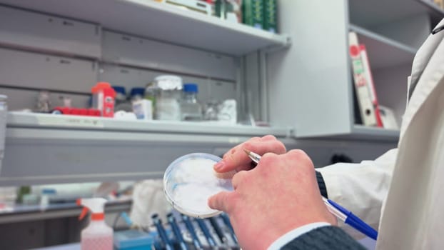 a scientist working in his lab with samples and researching