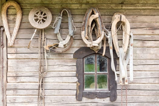 Old wooden house wall with old tools and stuff