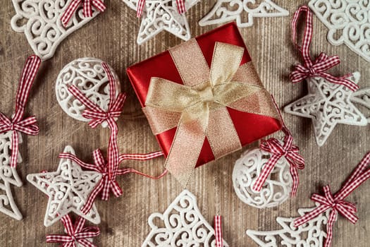 Gift box and christmas decorations on wooden table