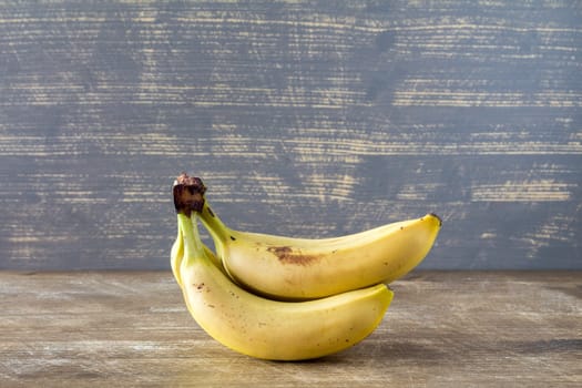 Bunch of banana fruits on the wooden background