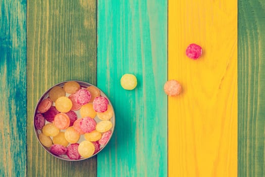 Multi colored candy in metal box, top view