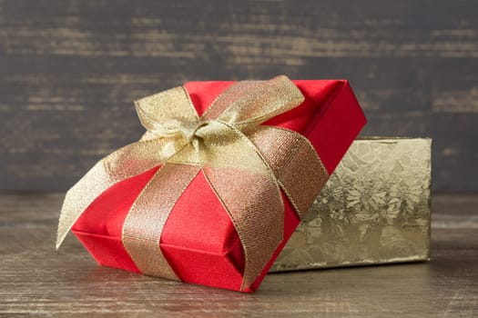 Holidays concept. Present box on wooden background.