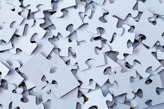 Pile of Blue Blank Puzzle Pieces Background.