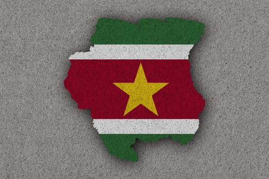 Map and flag of Suriname on felt