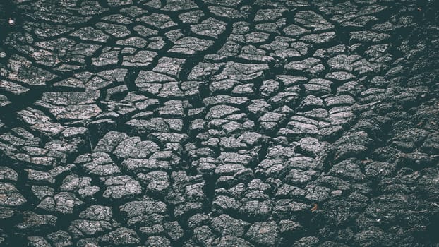Texture of cracked brown clay soil, crack earth and dry ground. Crack earth, dry ground surface texture.