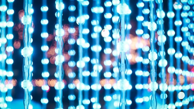 Blue string lights, wood background lightbulbs bokeh merry Christmas street lighting in street party in town garden evening people happy night street bokeh festival on streetlight vibrant bulb party lights string night