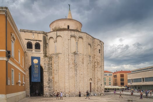 Zadar, Croatia, July 2019 Tourists admiring and taking pictures of St. Donata, circular church in early Romanesque architecture style
