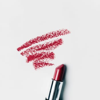 Red lipstick smears on the white background. High quality photo