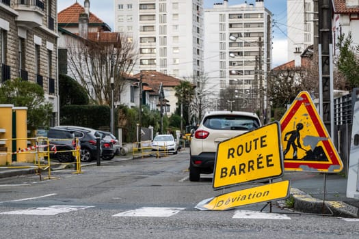 Road closed, diversion and road work signs in French town