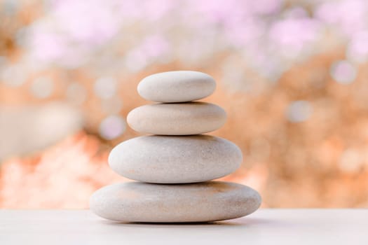 balancing pile of pebble stones, like ZEN stone, outdoor in springtime, spa wellness tranquil scene concept, soul equanimity mental calmness picture