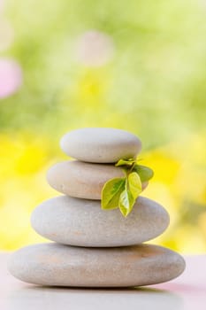 balancing pile of pebble stones, like ZEN stone, outdoor in springtime, spa wellness tranquil scene concept, soul equanimity mental calmness picture