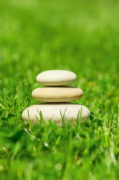 balancing pile of pebble stones, like ZEN stone, outdoor in springtime, spa wellness tranquil scene concept, soul equanimity mental calmness picture