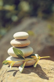 balancing pile of pebble stones, like ZEN stone, outdoor in springtime, spa wellness tranquil scene concept, soul equanimity mental calmness picture