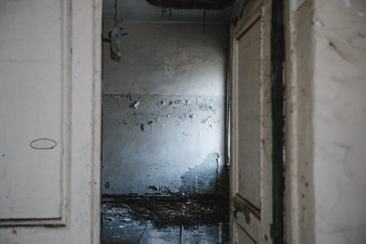 An open door to an abandoned old house. Abandoned building.