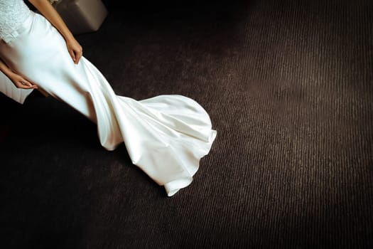 The bride's dress on the dark floor. Wedding.