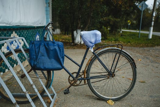 The bike is parked in the shop. An old bike.