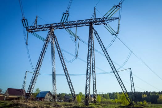 Power line supports. Electricity transmission and posts.