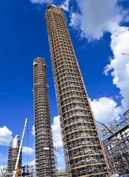 Cracking and reforming columns at a petrochemical plant Petrochemical and refinery, industrial landscape view of the plant.