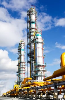 Cracking and reforming columns at a petrochemical plant Petrochemical and refinery, industrial landscape view of the plant.