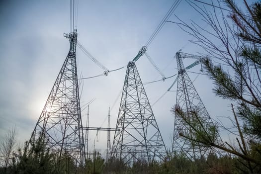 Power line supports. Electricity transmission and posts.
