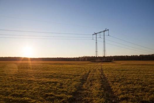 Power line supports. Electricity transmission and posts.