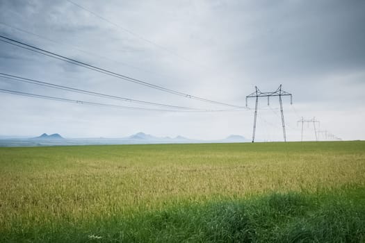 Power line supports. Electricity transmission and posts.