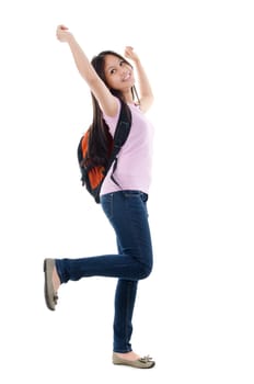 Full length pan Asian teen student cheering with arms raised, isolated on white background.