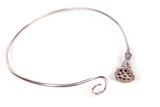Close up of silver necklace isolated on white background, manufactured by Ornella Salamone