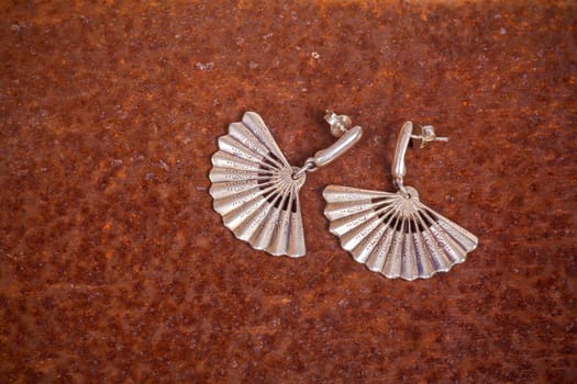 Close up of silver earrings, manufactured by Ornella Salamone